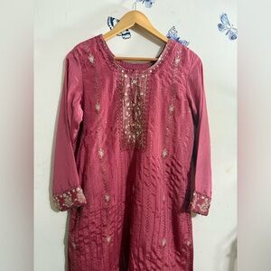 Elegant Embroidered Pink Salwar kamez with matching dupatta and salwar pants.